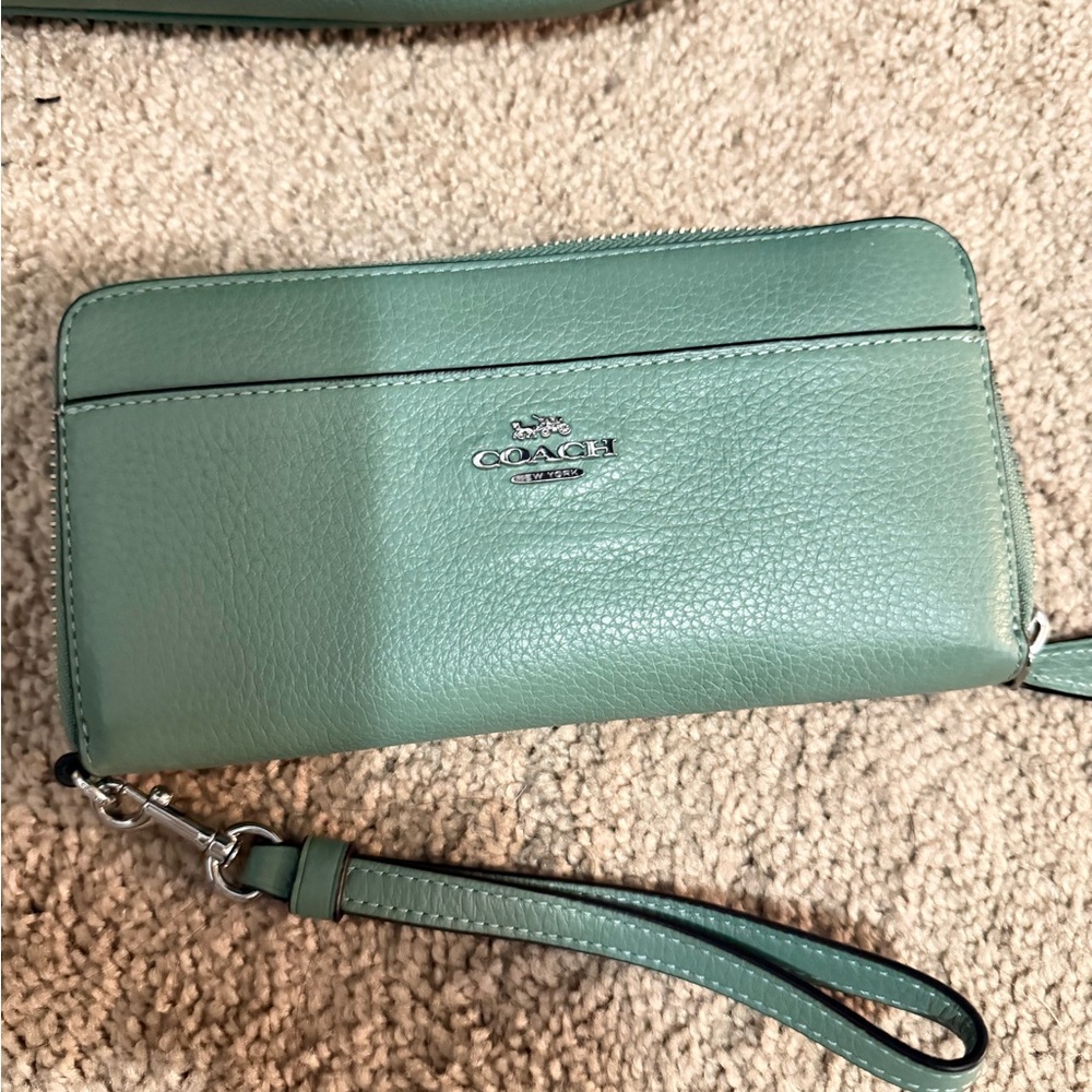 Coach Mint Green Leather Wristlet
Matching Bag in my closet Bundle for Deals! - Picture 3 of 8